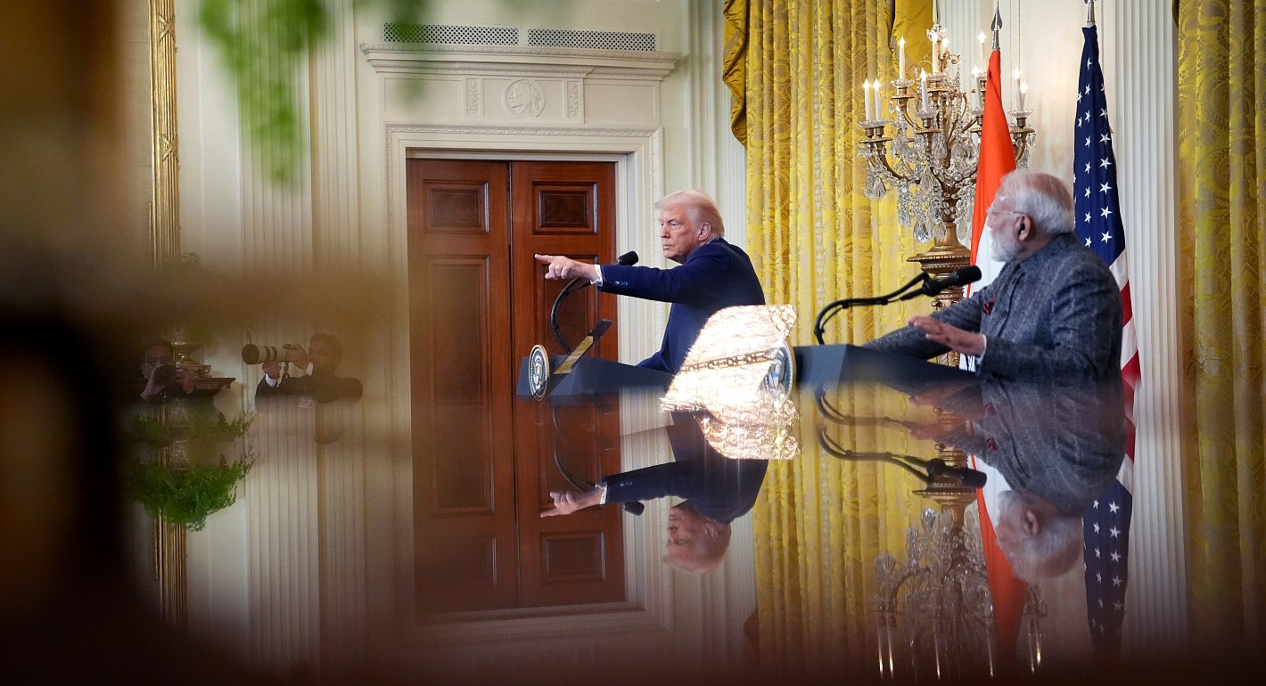 Wide shot of Trump and Modi, with Trump pointing