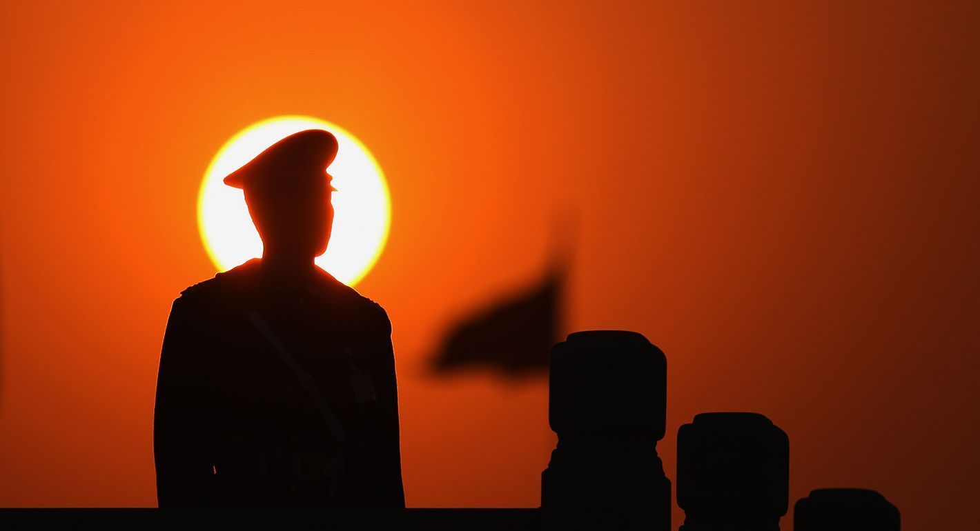 A paramilitary policeman stands guard at Beijing's Tiananmen Square during a plenary session of the Chinese People's Political Consultative Conference in the adjacent Great Hall of the People on March 7, 2009 in Beijing, China.