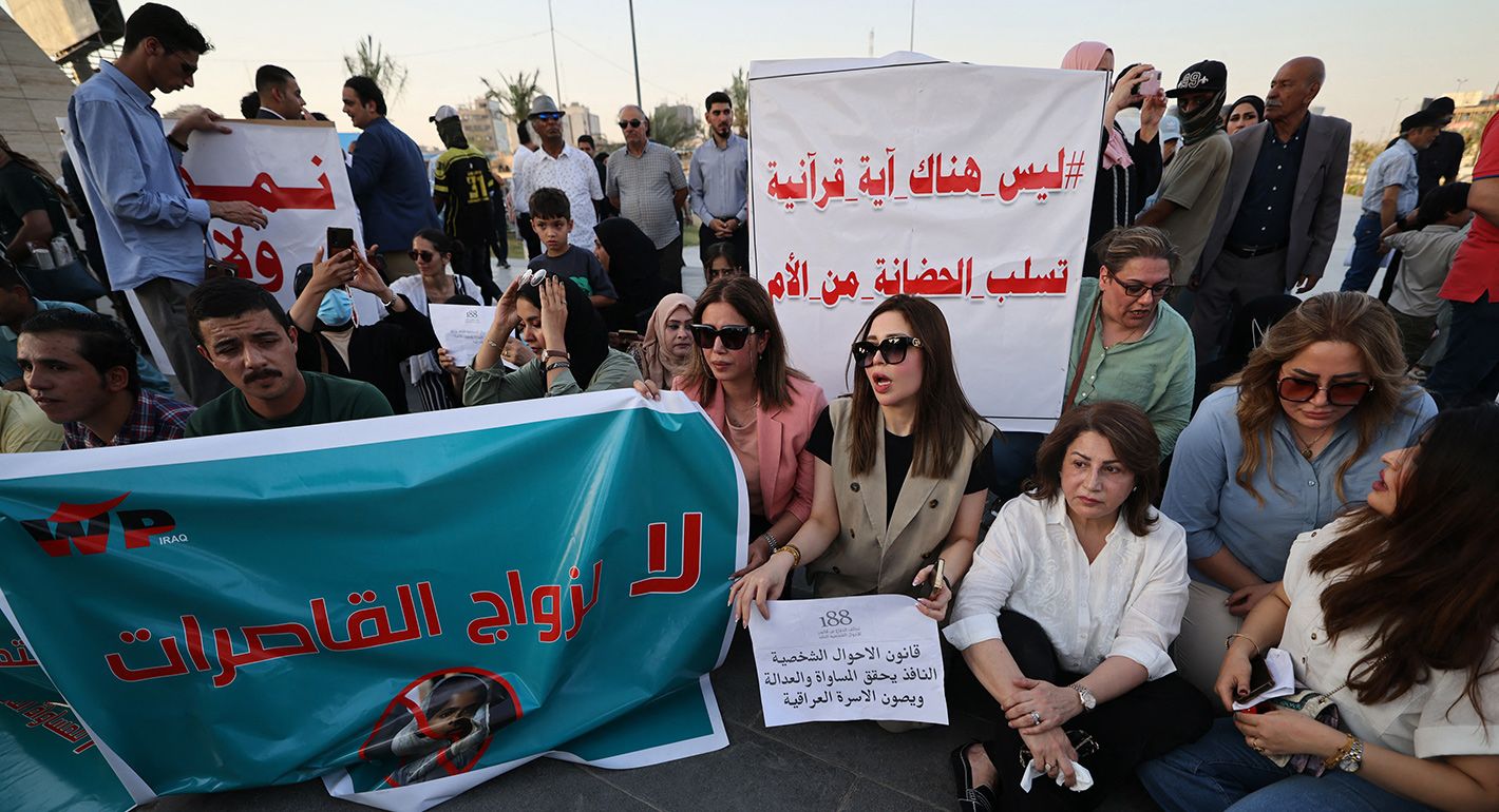 Iraqi men join women in a demonstration against underage marriage in Tahrir Square in central Baghdad on August 8, 2024, amid parliamentary discussions over a proposed amendment to the Iraqi Personal Status Law.