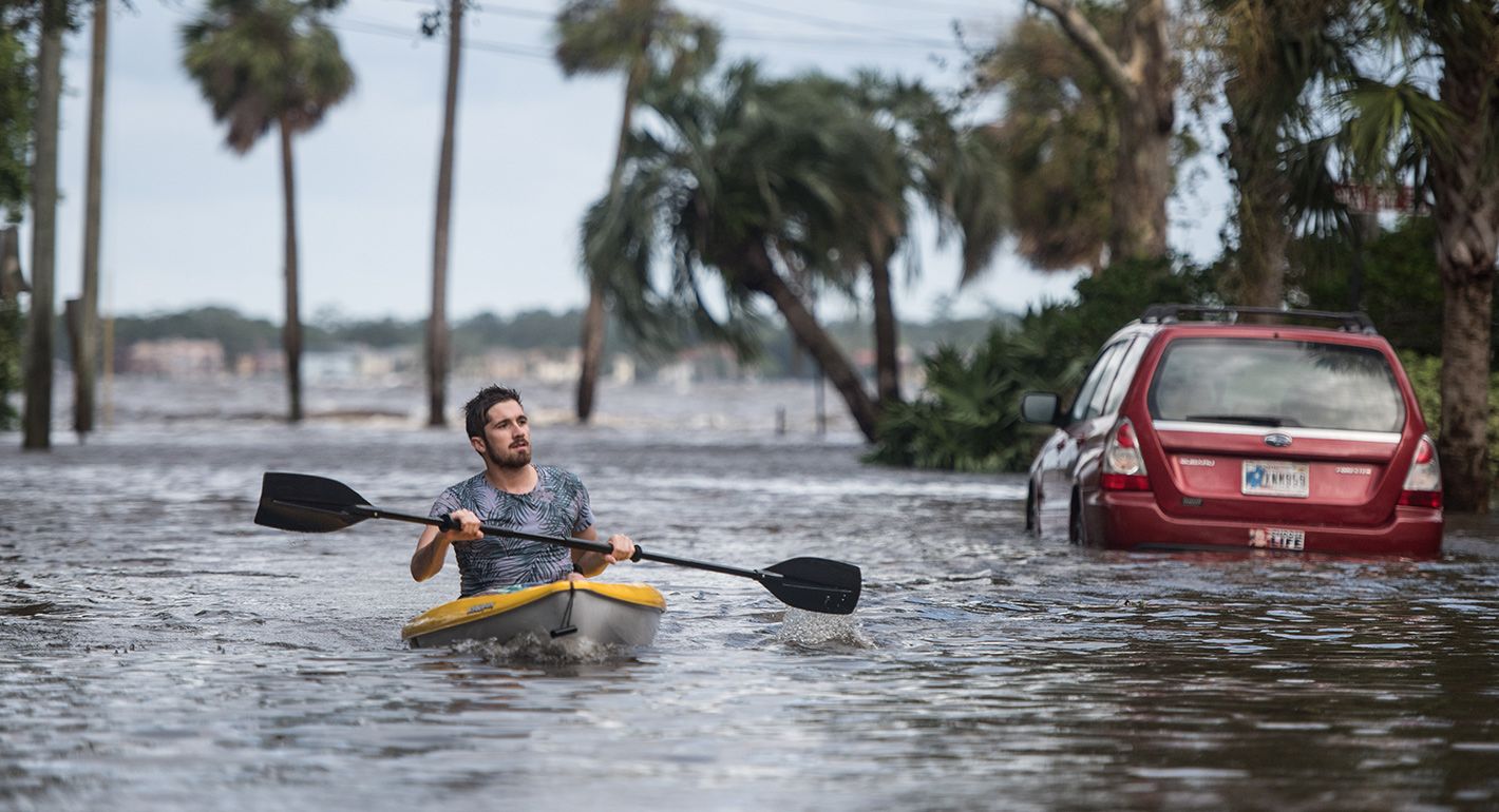 Justin Hand navigates storm surge flood waters from Hurricane Irma along the St. Johns River on Sept. 11, 2017 in Jacksonville, Florida. Flooding in downtown Jacksonville along the river topped a record set during Hurricane Dora in 1965. 