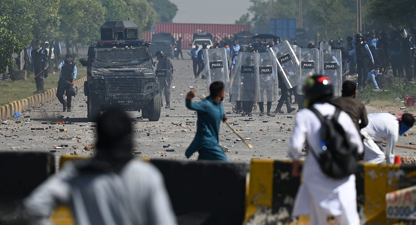 Police managing a public gathering in Pakistan, highlighting event security needs